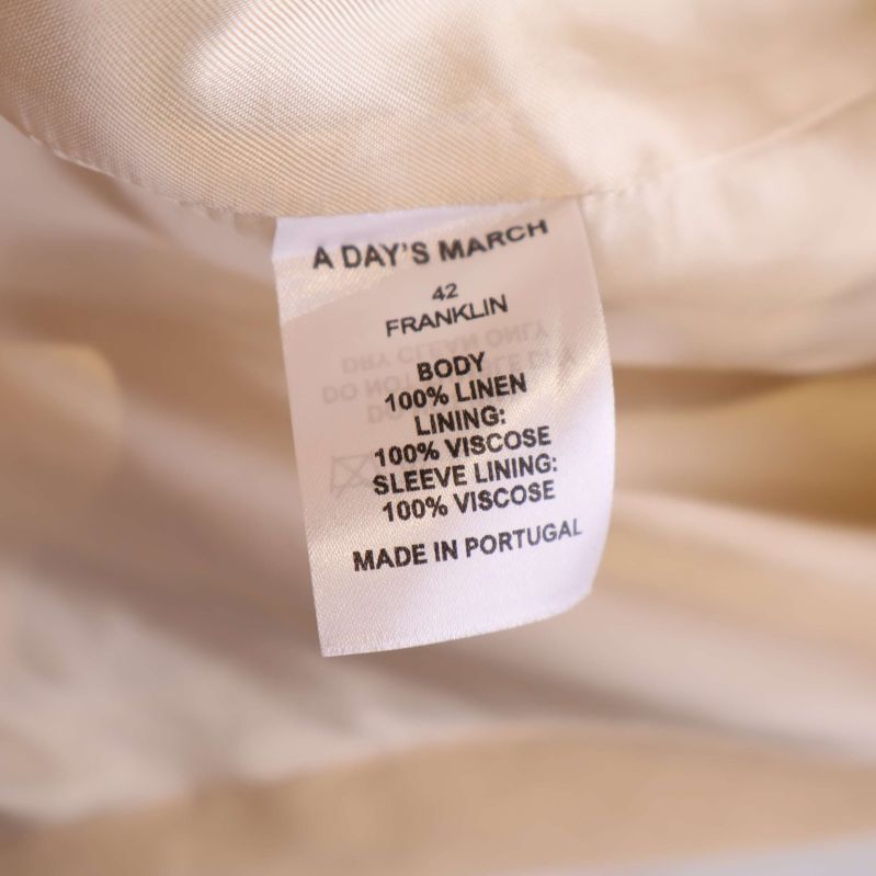 Materiallapp visar body i 100% linne, foder i 100% viskos