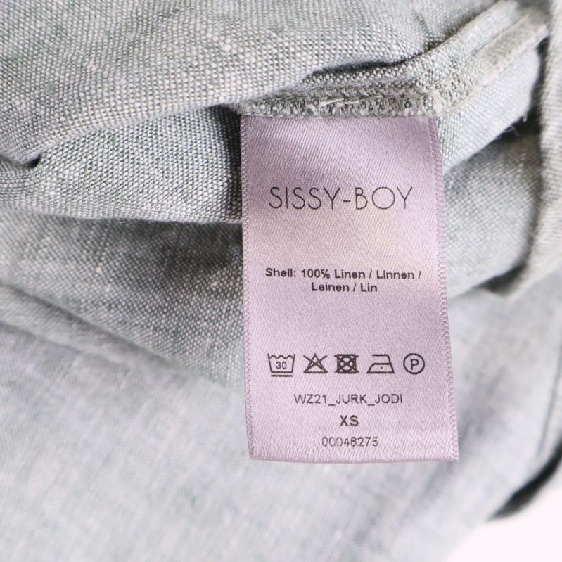 Materialetikett som visar 100% linne