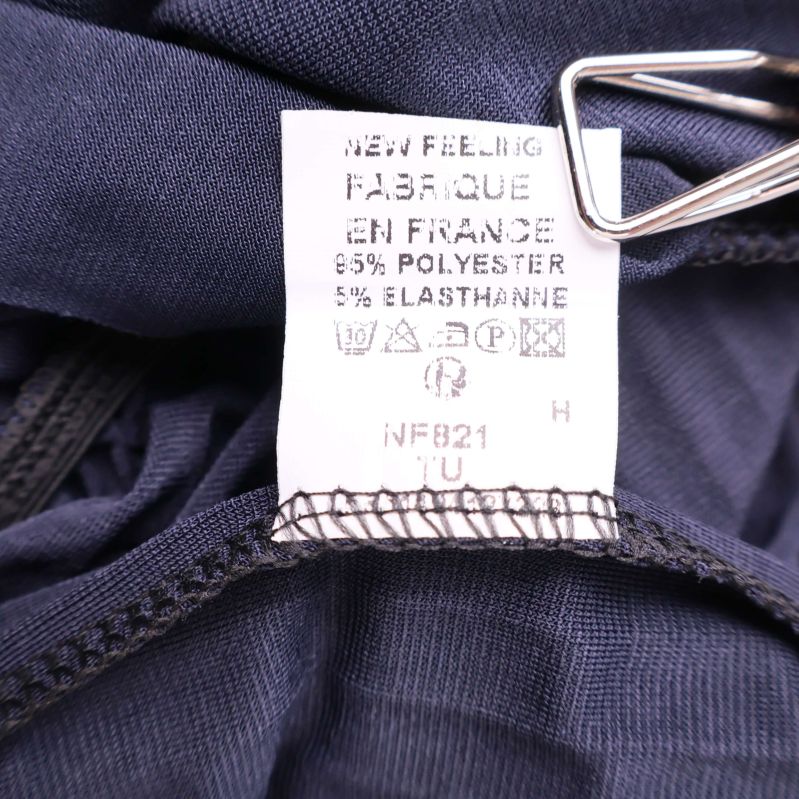 Materiallapp som visar 95% polyester och 5% elastan