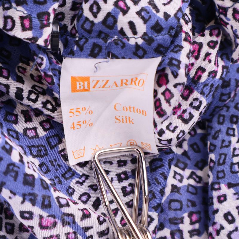 Materiallapp visar 55 procent bomull och 45 procent silke