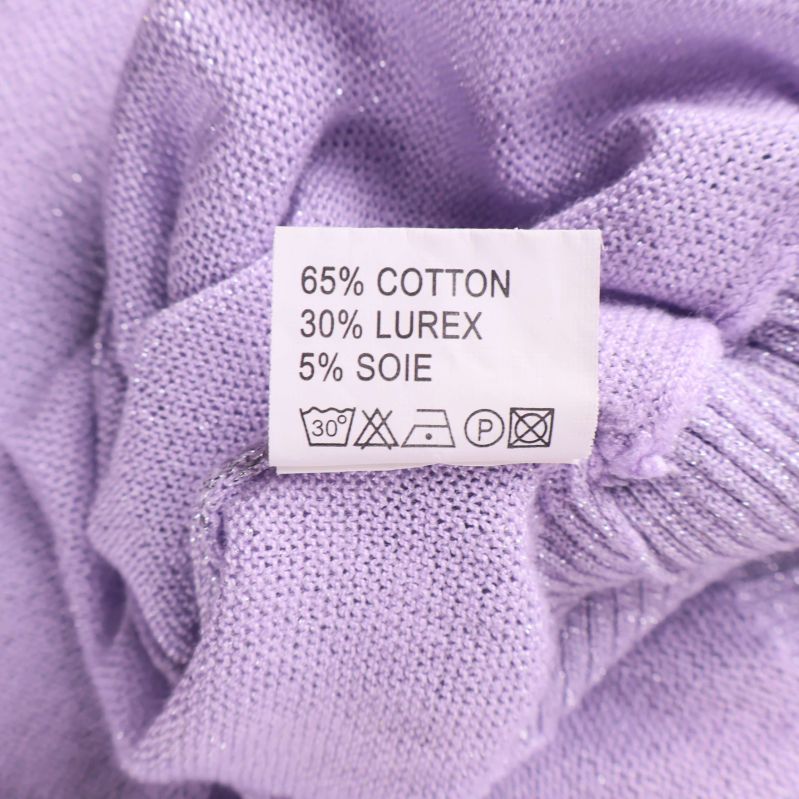 Materiallapp som visar sammansättning bomull, lurex och silke