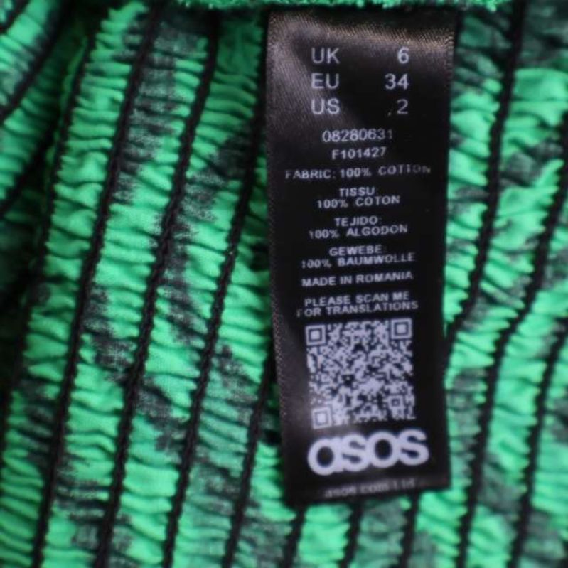 Material- och tvättlapp från ASOS, visar storlek och material