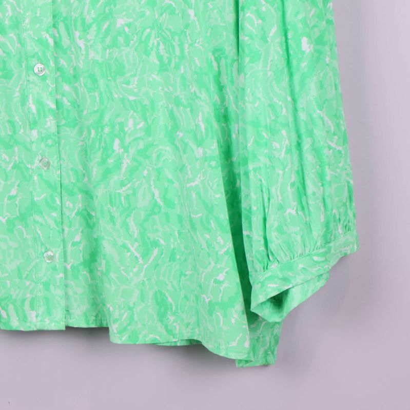 Ärm med rynkad manschett och knappslå