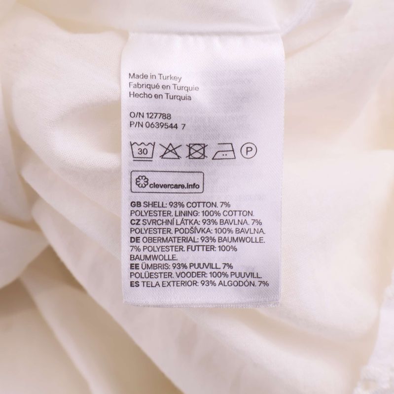 Materiallapp med information om bomull och polyester