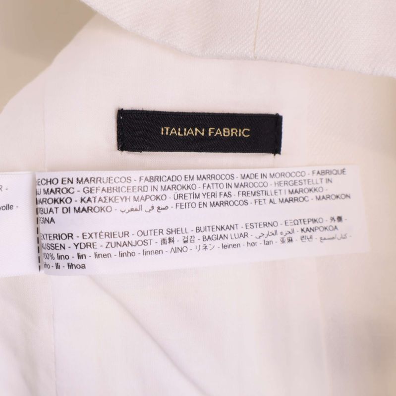 Materialetikett visar tvättråd och tyginnehåll