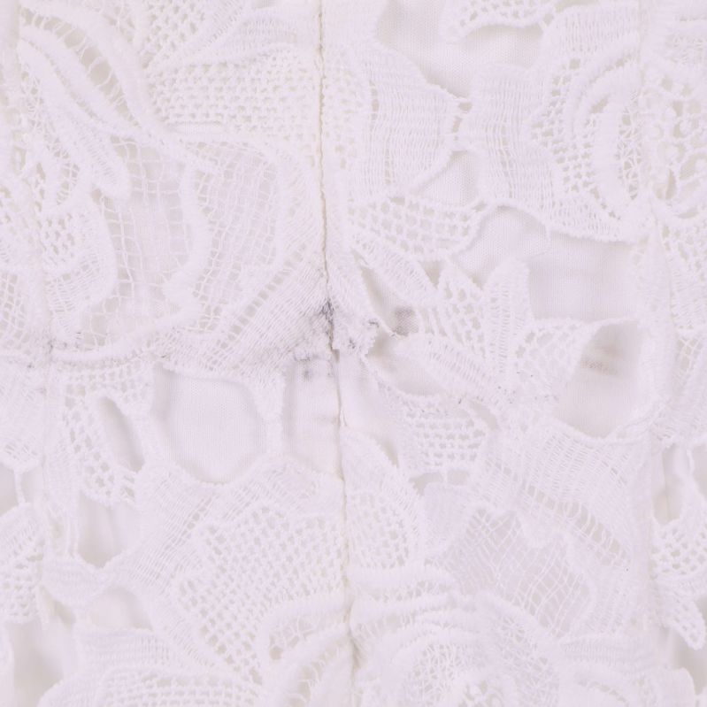 Närbild på söm på baksida med liten lagning