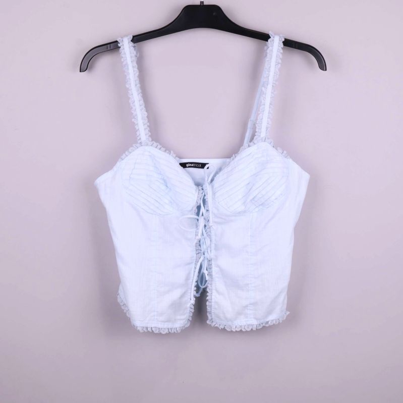 Ljust blått bustierlinne med spetskant och snörning