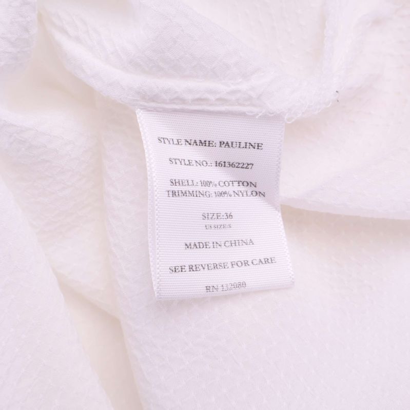 Materiallapp visar 100% bomull och 100% nylon