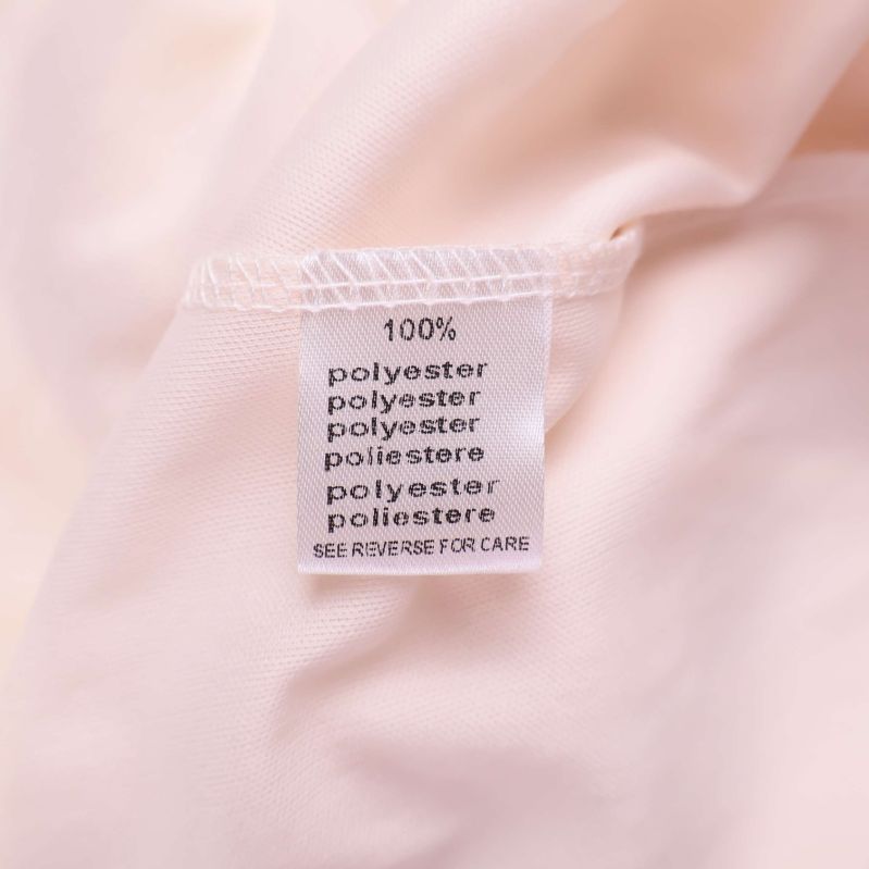 Materiallapp med 100 procent polyester på flera språk