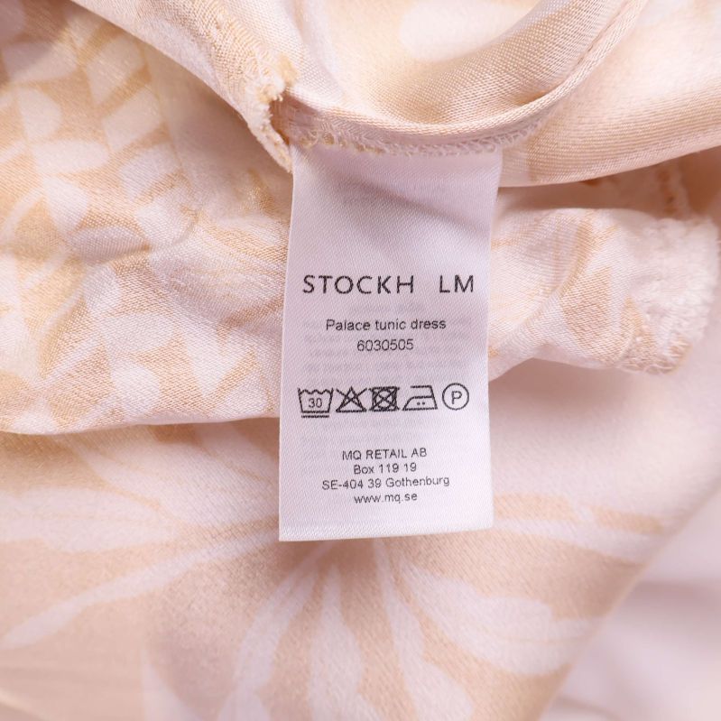 Omsorgsetikett Stockh LM med modellnamn