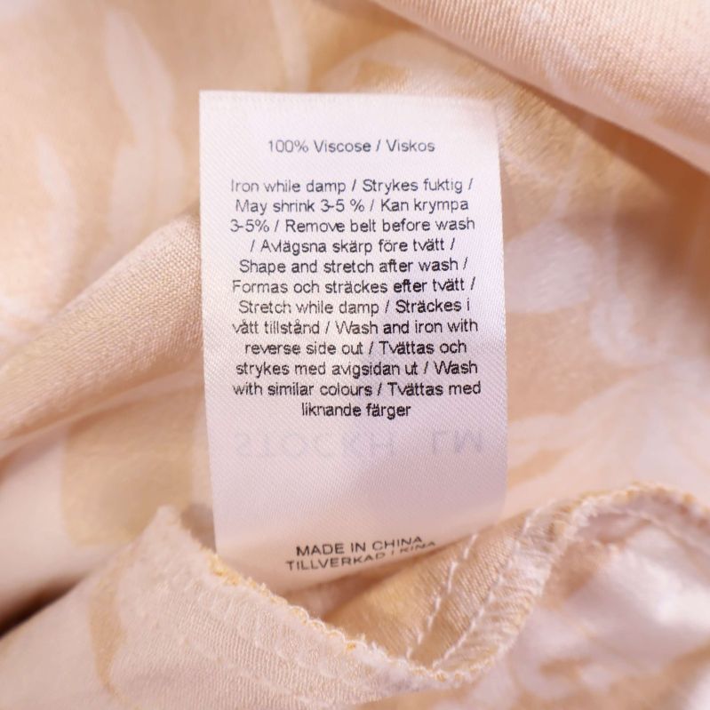 Materialetikett visar 100 procent viskos