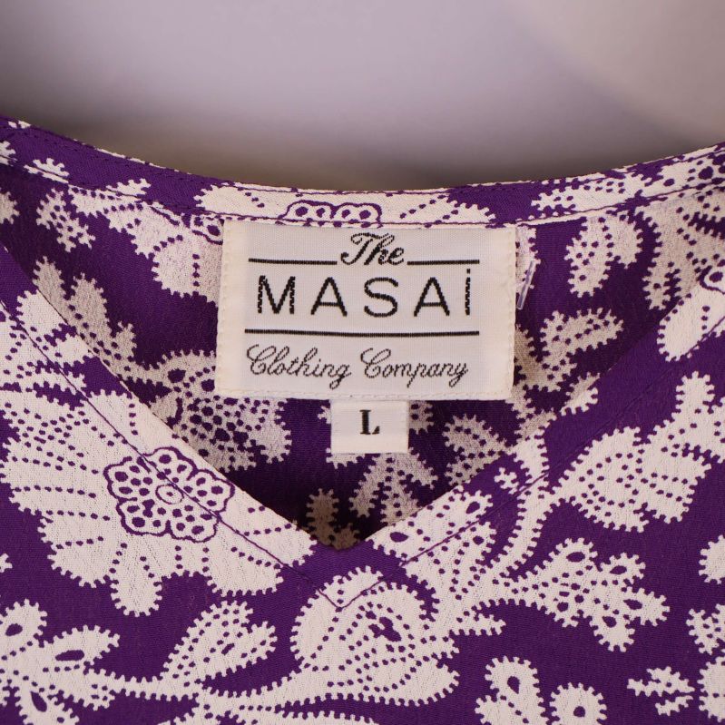 Närbild på märkesetikett The Masai Clothing Company