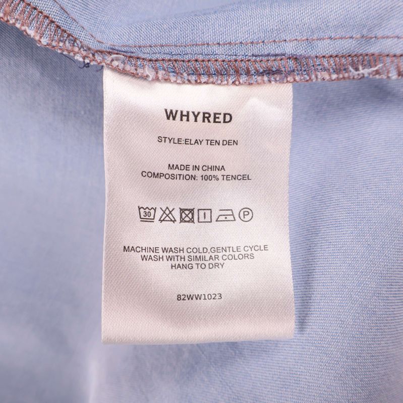 Materiallapp med texten 100% tencel Whyred