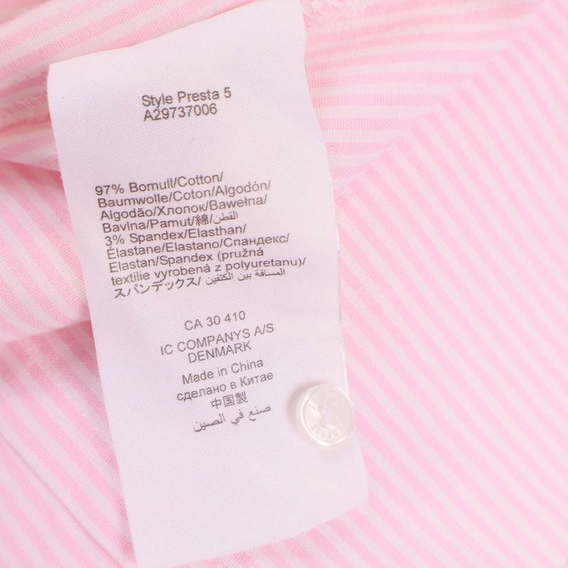 Materiallapp med information om bomull och elastanblandning