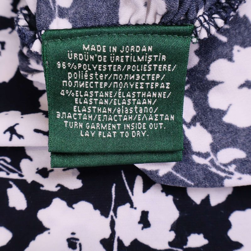 Materialetikett med text om polyester och elastan