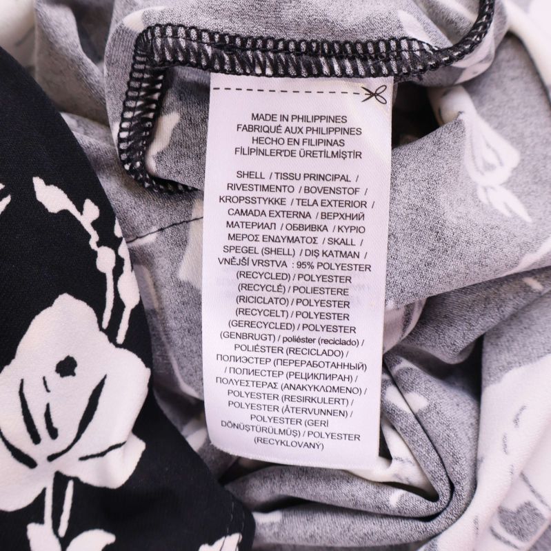 Materialetikett med information om polyester