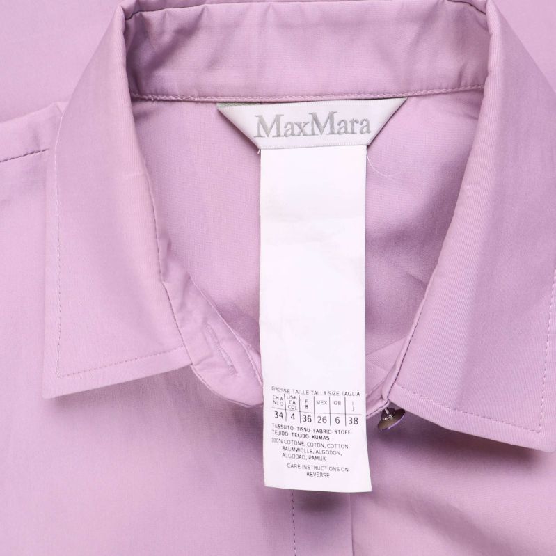 MaxMara-etikett och materiallapp med tvättsymboler i lila skjorta