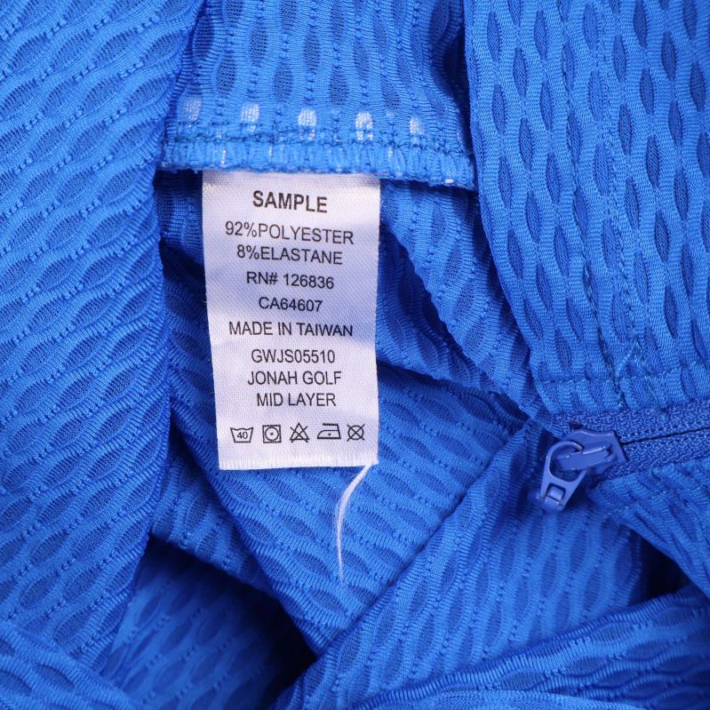 Materiallapp visar 92 procent polyester och 8 procent elastan