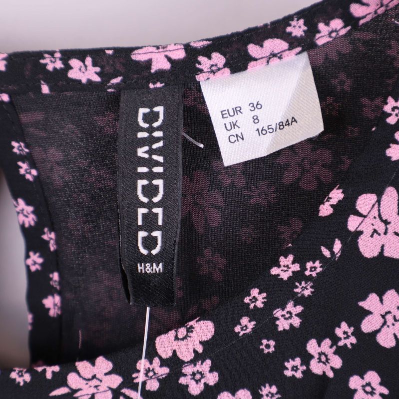 Storleksetikett visar EUR 36 och Divided H&M