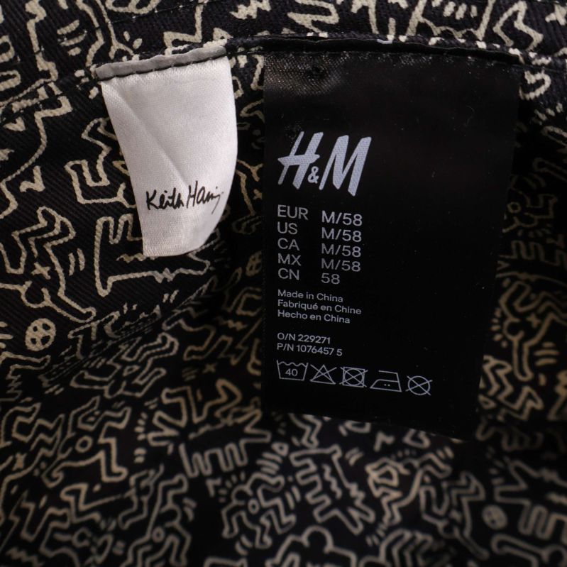Material- och storleksetikett från H&M och Keith Haring