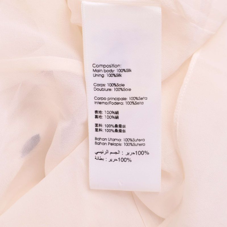 Materiallapp med information om 100% silke