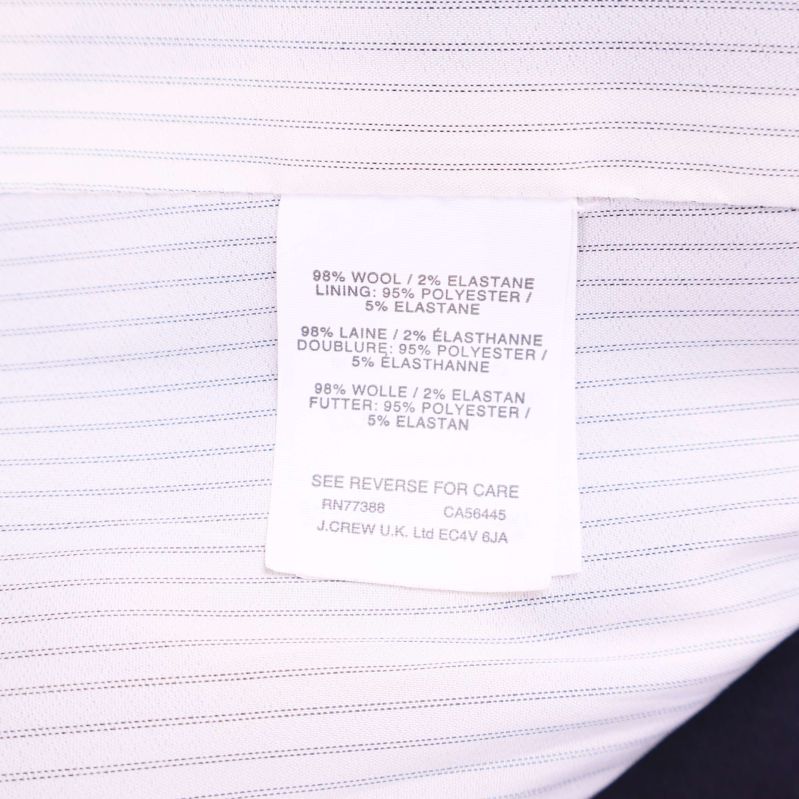 Materiallapp visar 98% ull 2% elastan och foder polyester samt elastan