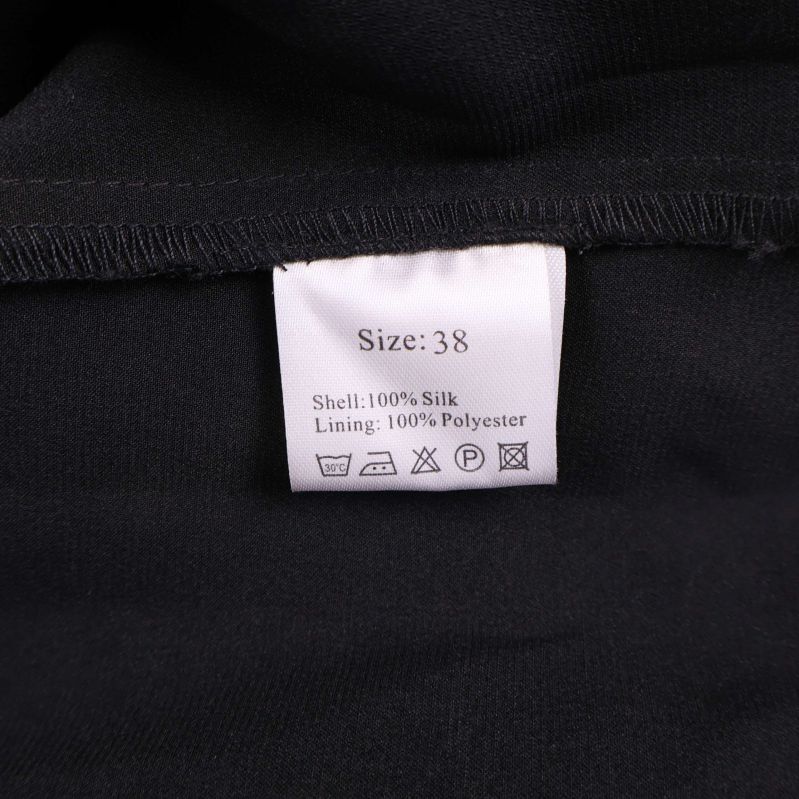 Materialetikett med information om siden och polyester
