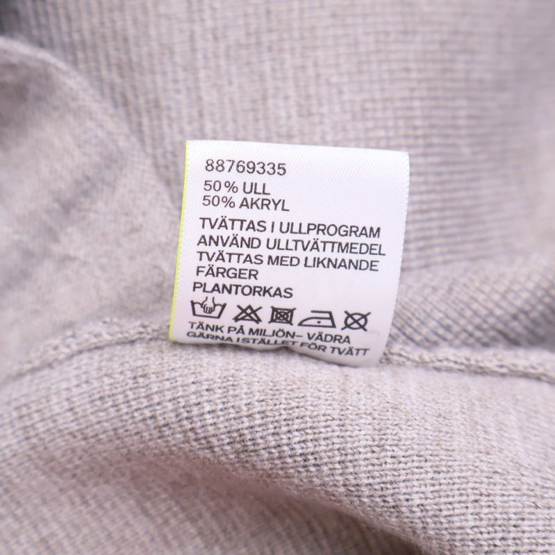 Materiallapp visar 50 procent ull 50 procent akryl
