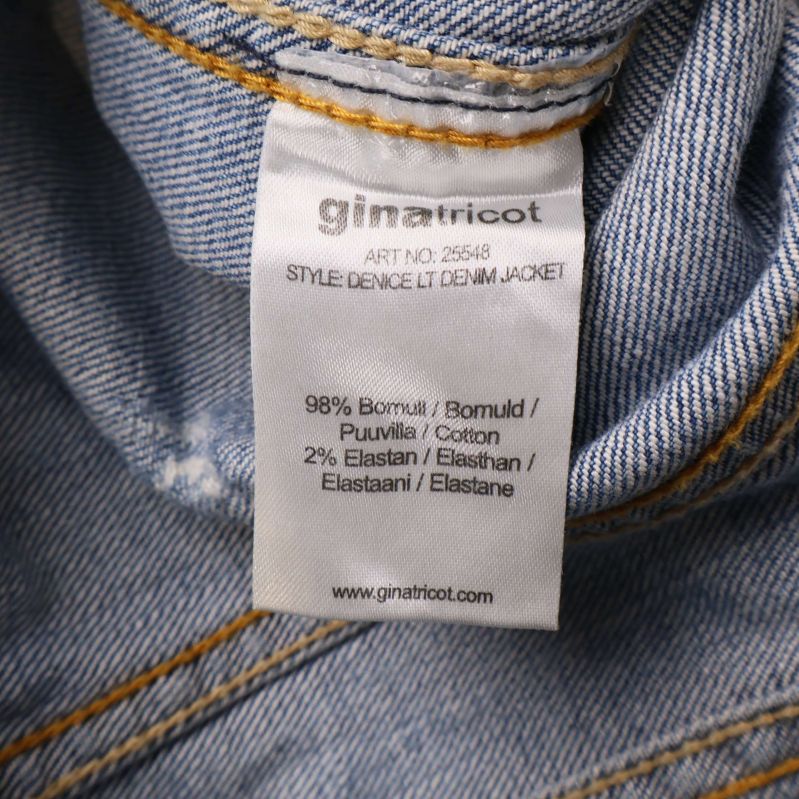 Materialetikett med text 98% bomull 2% elastan ginatricot