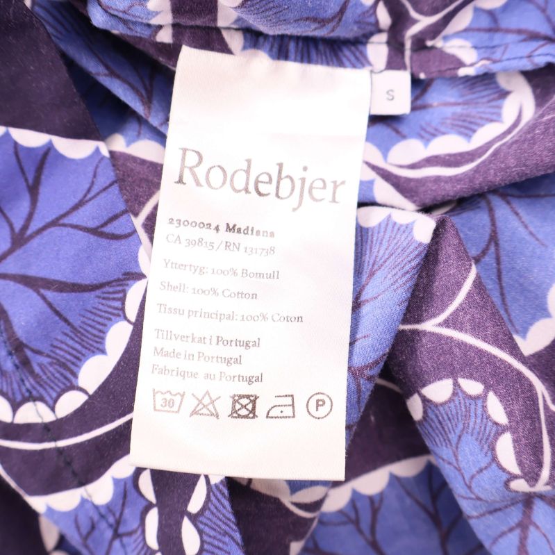 Materiallapp som visar Rodebjer och 100% bomull