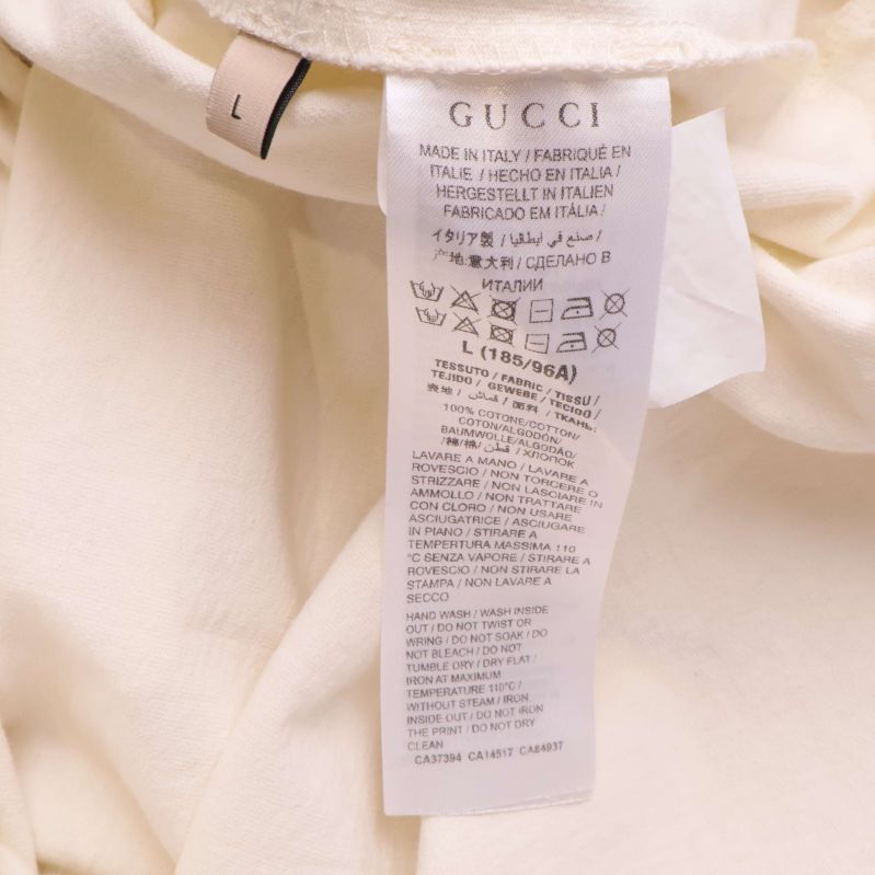 Materialetikett visar information och tvättråd för T-shirt från Gucci