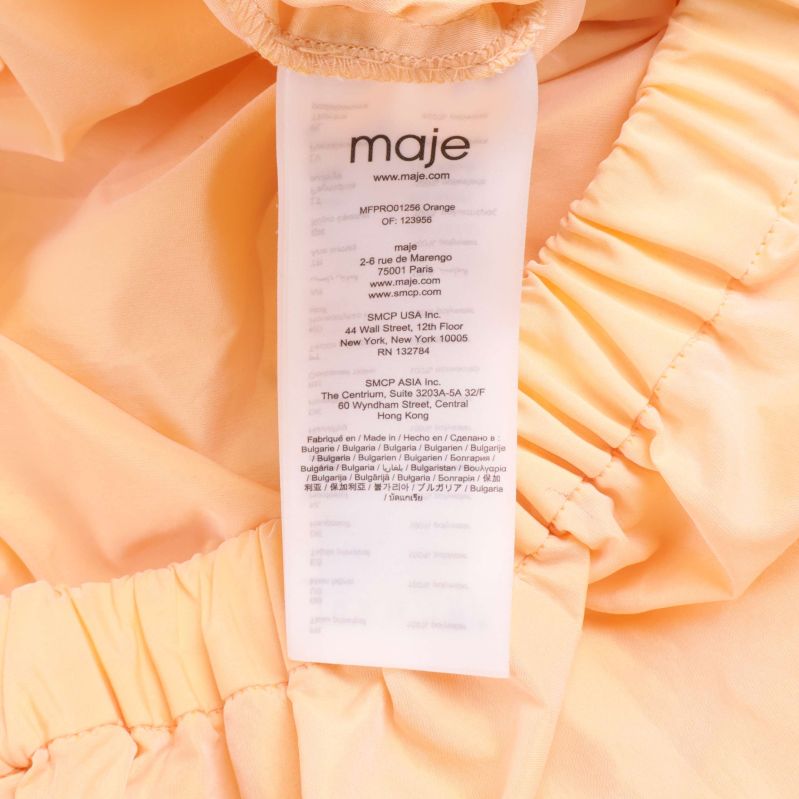 Materiallapp med information om 100% bomull från maje