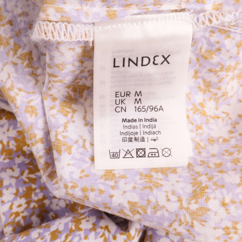 Två etiketter med Lindex och materialinformation