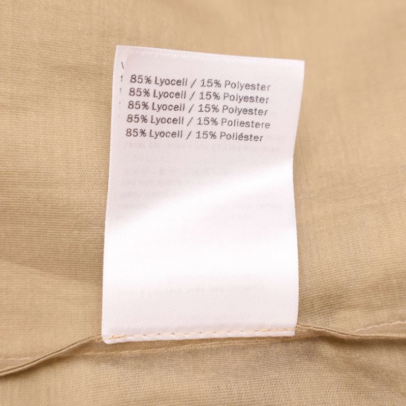 Materiallapp som visar 85% lyocell och 15% polyester