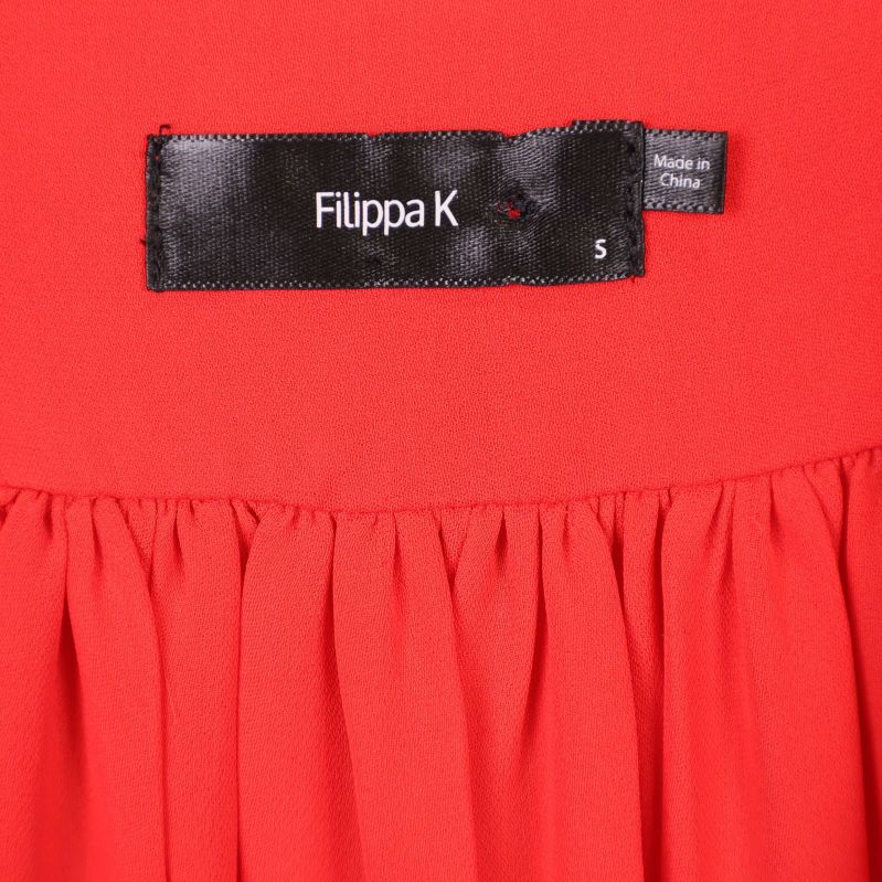Filippa K svart etikett och storleksmärkning S