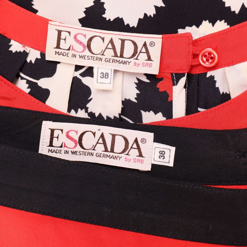 Närbild på Escada-etiketter i blus och kjol storlek 38