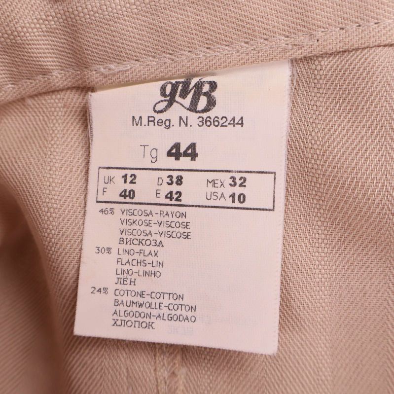Materiallapp med procent för viskos, linne och bomull i beige byxa
