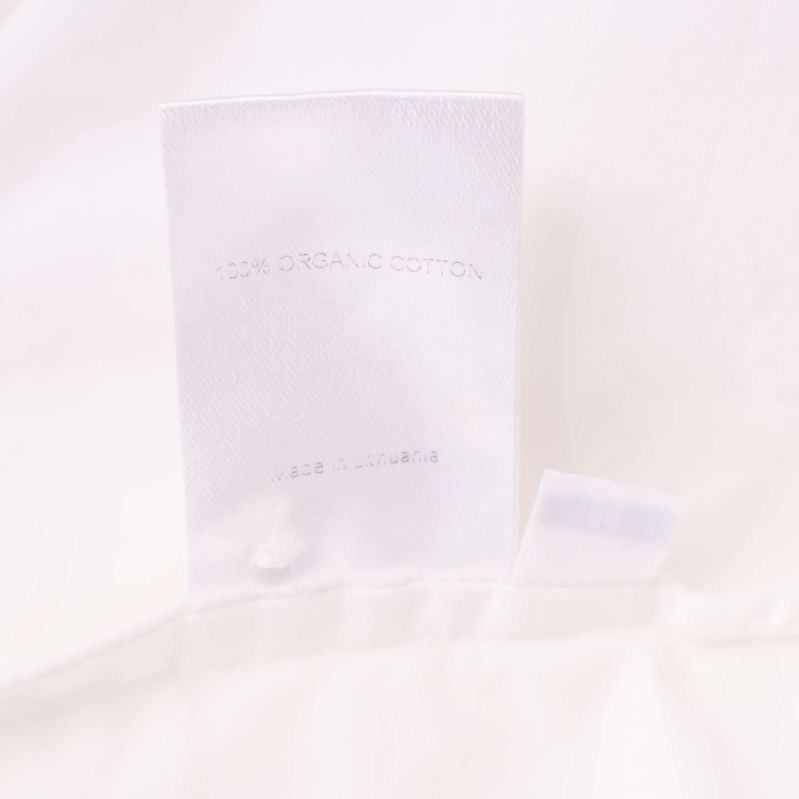 Materiallapp med texten 100% organic cotton