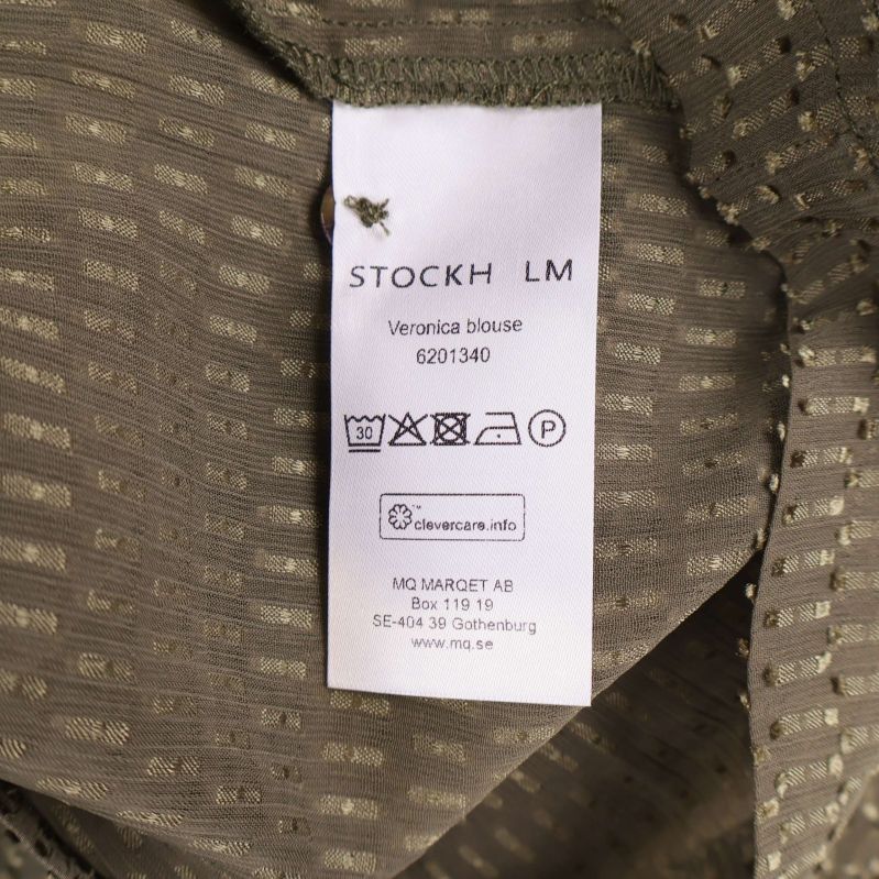 Tvättrådsetikett från Stockh LM med modellnamn och artikelnummer