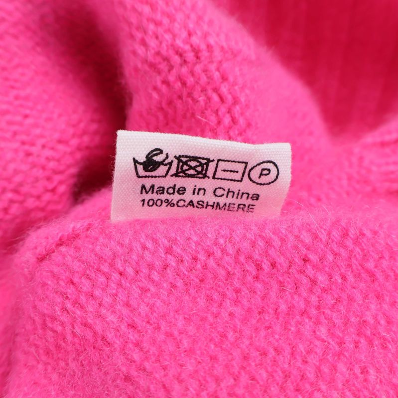 Materialetikett med information om 100% kashmir