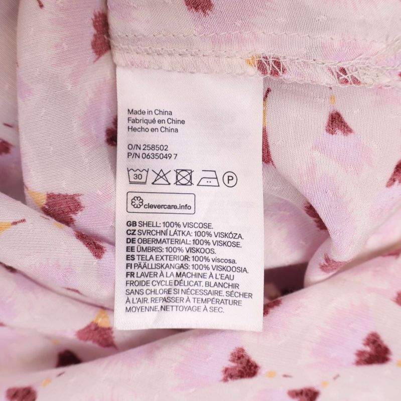 Material- och tvättetikett med 100% viskos info