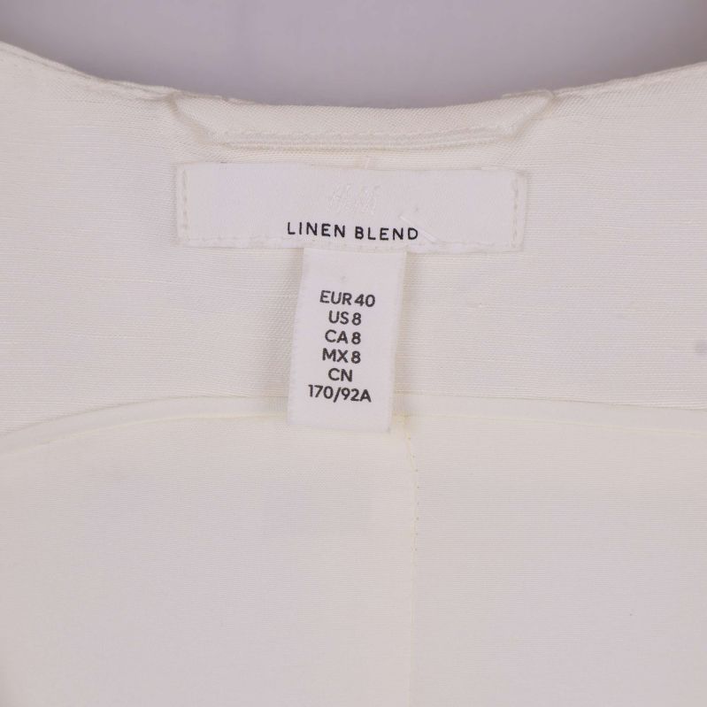 Nacketikett med storleksinformation och text linen blend