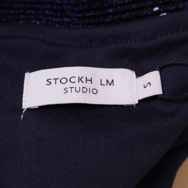 Märkesetikett Stockh lm Studio i blå paljettkjol