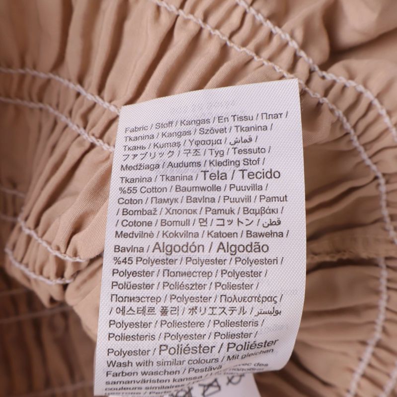 Materiallapp visar bomull och polyester innehåll