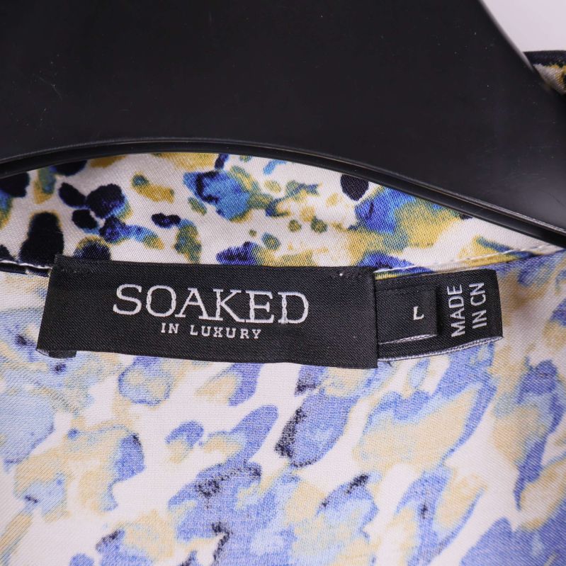Soaked in Luxury-logga på svart etikett i nacken