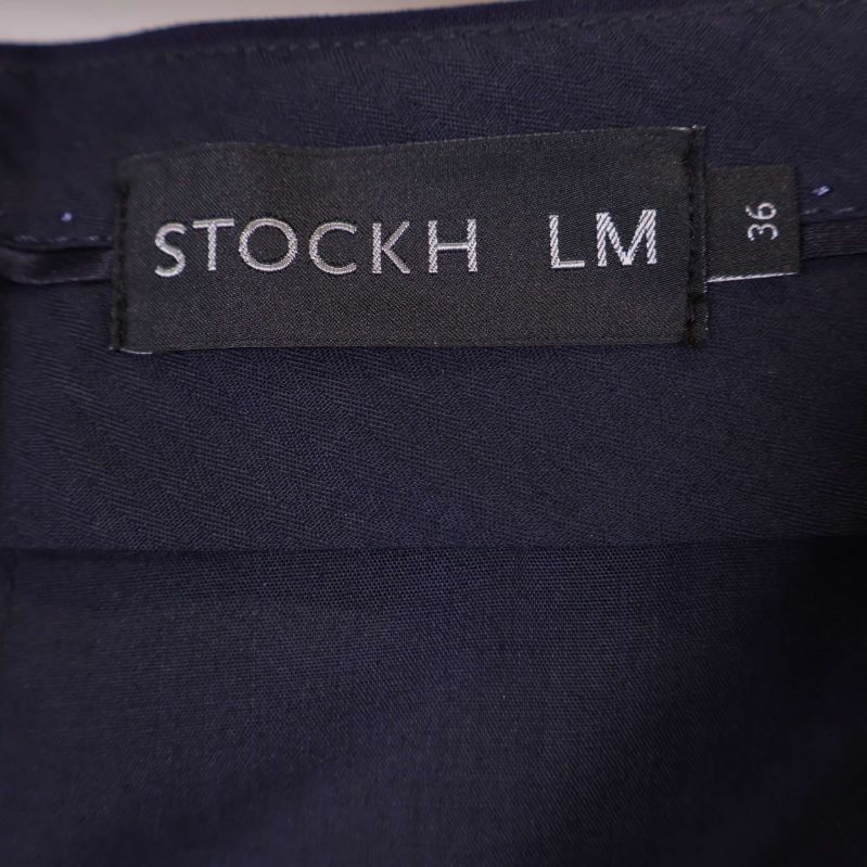 Närbild etikett Stockh LM storlek 36
