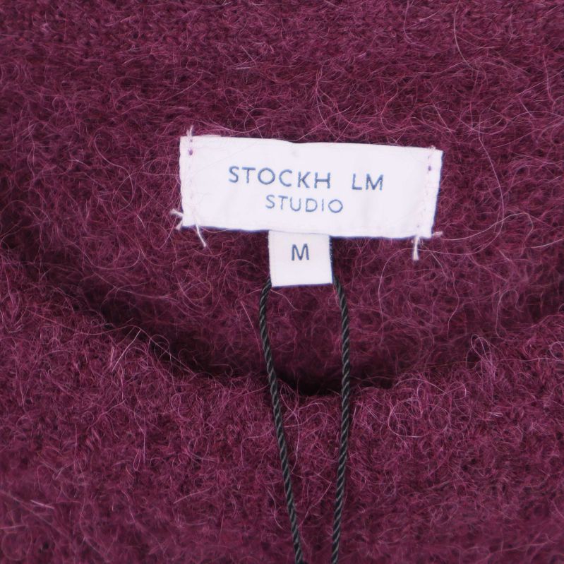 Närbild på STOCKH LM Studio-etikett och storlek M