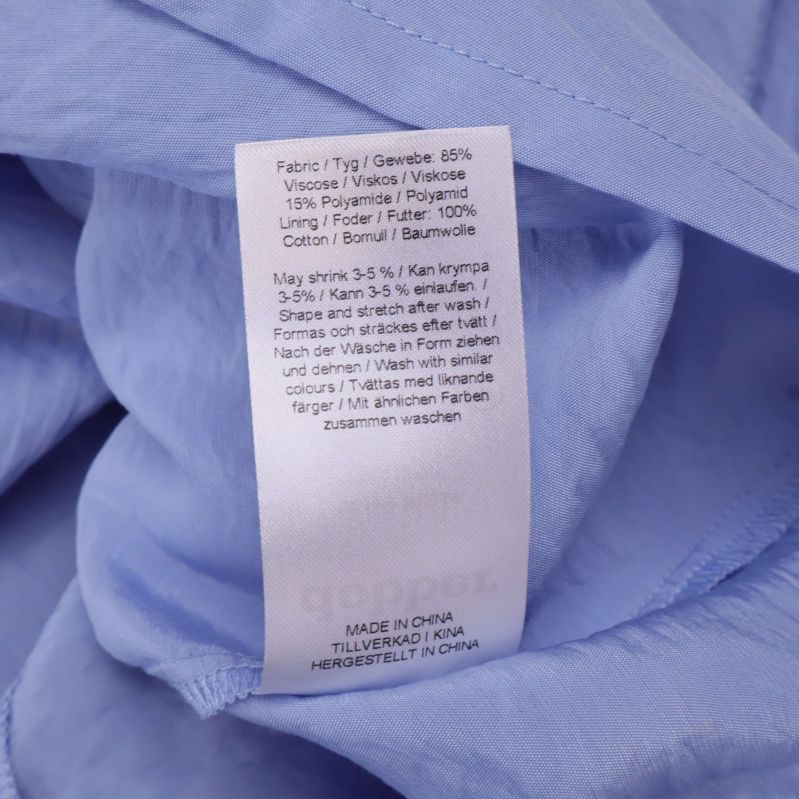 Materiallapp visar sammansättning av viskos, polyester och bomull