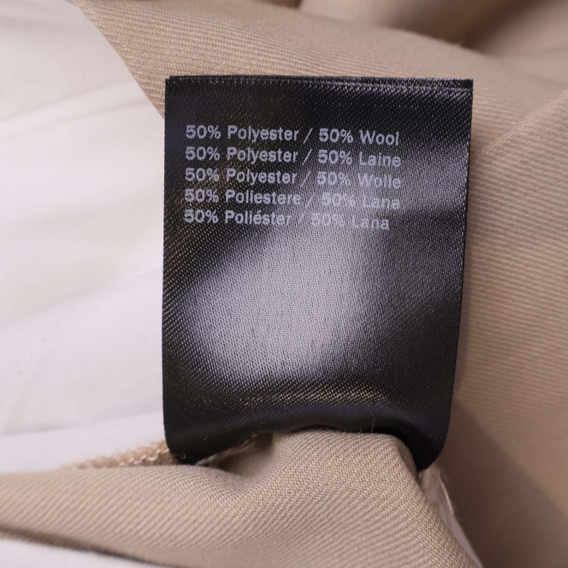 Materiallapp med information om 50% polyester och 50% ull