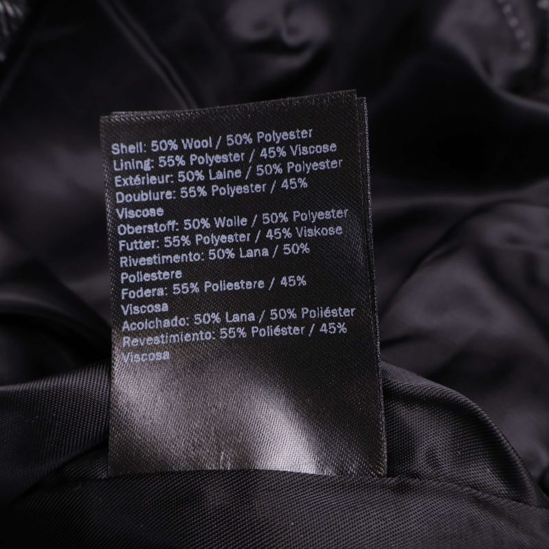 Materialetikett med sammansättning: ull, polyester, viskos